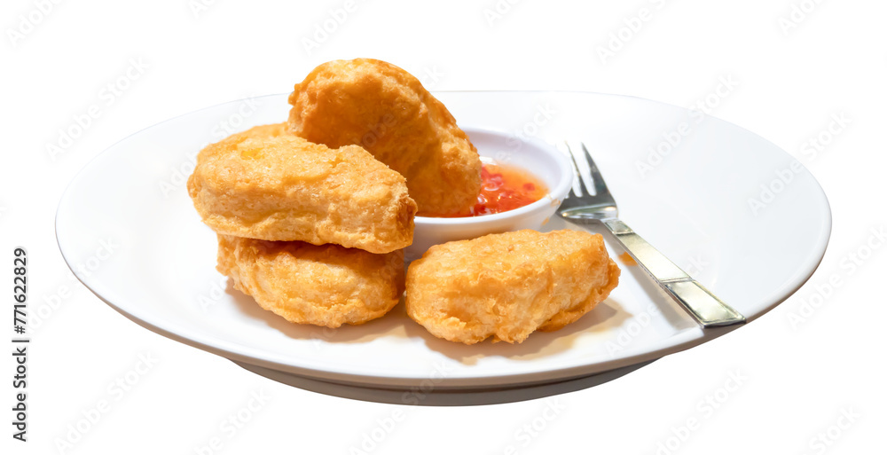 Front view of chicken nuggets with chili sauce in white plate isolated with clipping path in png file format