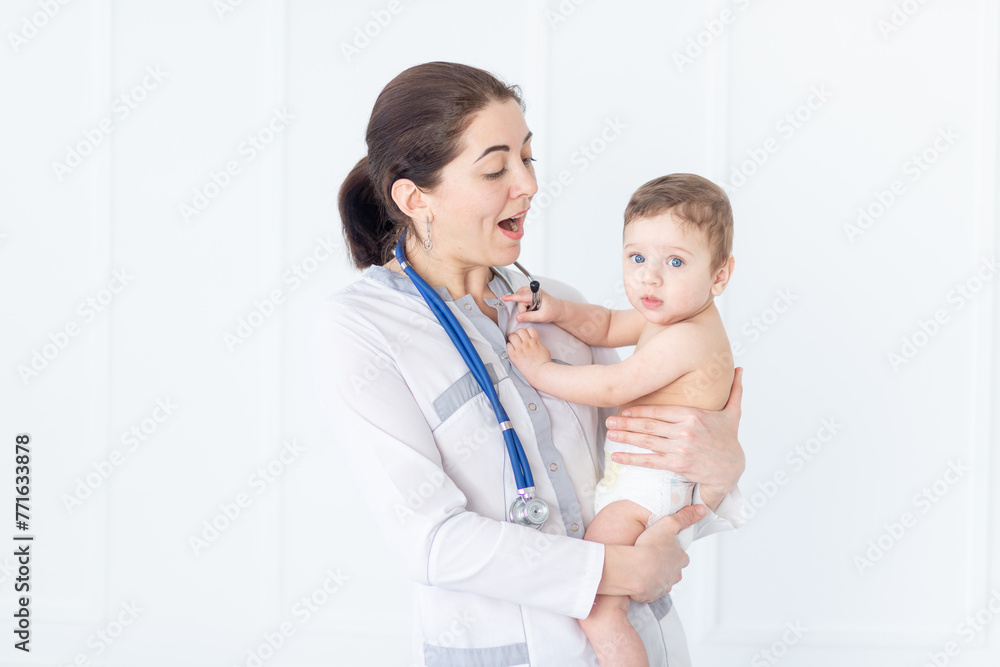 pediatrics, a doctor examines a baby boy, the concept of medicine and health pediatrics, a doctor examines a baby boy, the concept of medicine and health