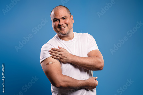 man with a vaccination bandage photo