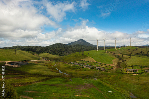 Wind turbines for electric power production on the hills. Wind power plant. Ecological landscape. Ambewela, Sri Lanka.