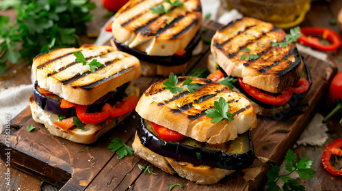 Grilled eggplant, bell pepper, tomato and mozzarella on black background ,Background of baked eggplant, tomatoes and zucchini
