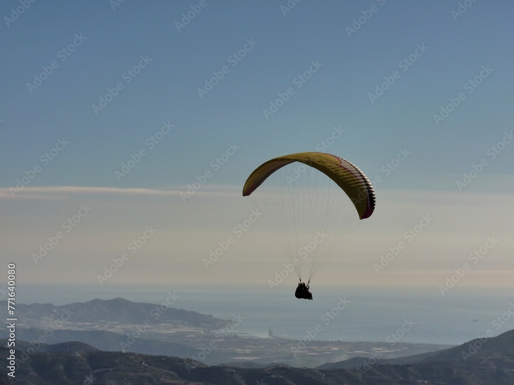 Tandem paraglider flying from Otivar, Spain
Tandem paraglider flying from Otivar, Spain