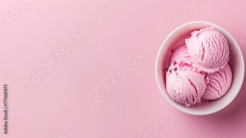 Top view close-up of Delicious Pink Ice Cream Scoops in White Bowl. Copy space