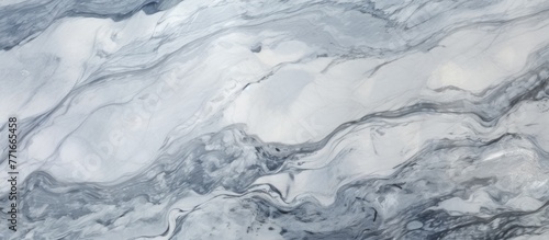 An icy closeup of a blue and white marble texture resembling a snowcovered slope on a glacial landform. This winter event showcases the freezing beauty of an ice cap landscape
