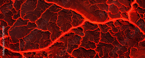 Close-up of fiery red lava like texture with vibrant orange channels. Intense crimson and scarlet hues dominate the molten landscape, rivulets ablaze. photo