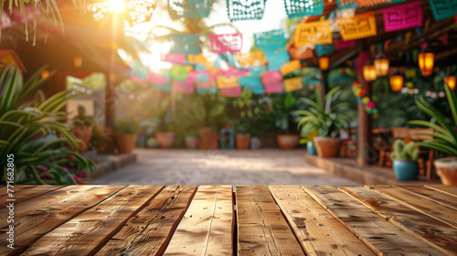 Empty wooden table top on mexican Cinco de Mayo festival background at sunset photo