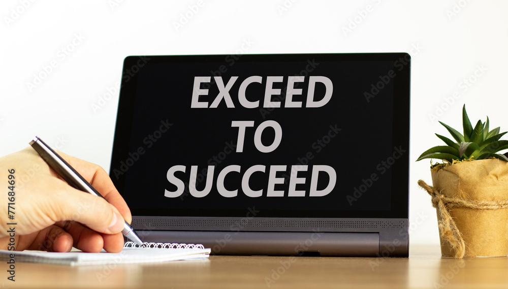 Exceed to succeed symbol. Concept words Exceed to succeed on beautiful tablet screen. Beautiful wooden table white background. Businessman hand. Business and exceed to succeed concept. Copy space. Exceed to succeed symbol. Concept words Exceed to succeed on beautiful tablet screen. Beautiful wooden table white background. Businessman hand. Business and exceed to succeed concept. Copy space.