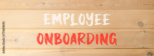 Employee onboarding symbol. Concept words Employee onboarding on beautiful wooden wall. Beautiful wooden wall background. Business employee onboarding concept. Copy space. photo