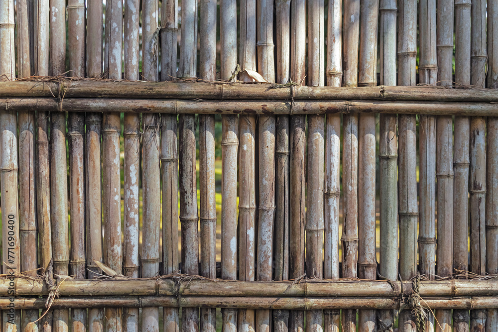 Abstract oriental background featuring detail of bamboo fence in Nagoya Japan.