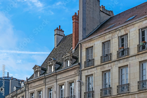 Urban vintage abstract background  featuring dark winter streets and architecture details of Dijon city in France.
