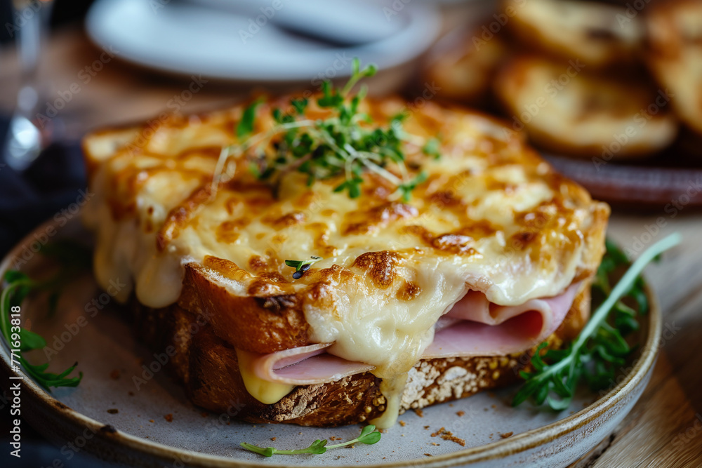 Croque Monsieur - A hot sandwich with ham, Gruyère cheese, covered with béchamel sauce and baked until golden