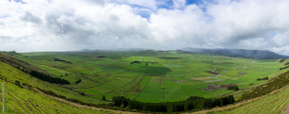 Stunning panoramic view of Terceira Island's lush green landscapes, captured from Serra do Cume viewpoint.