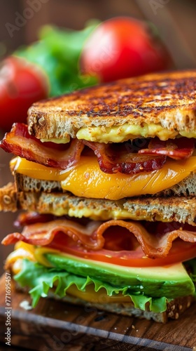 a grilled cheese sandwich with bacon lettuce tomato and avocado photo