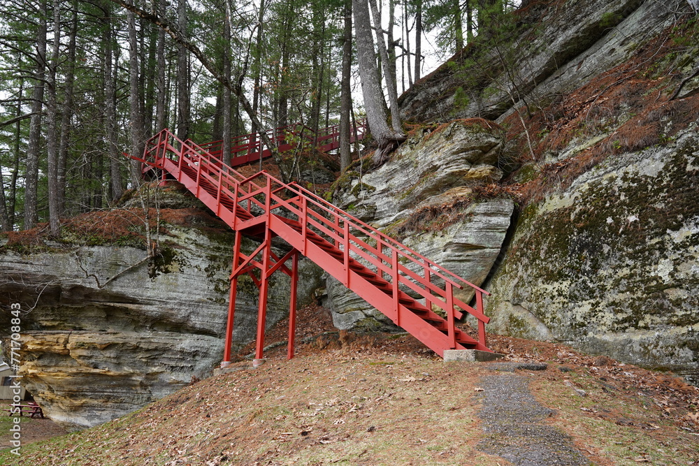 A path of Red stairs leads up a rocky hillside at Rockbridge, Wisconsin  - obrazy, fototapety, plakaty 