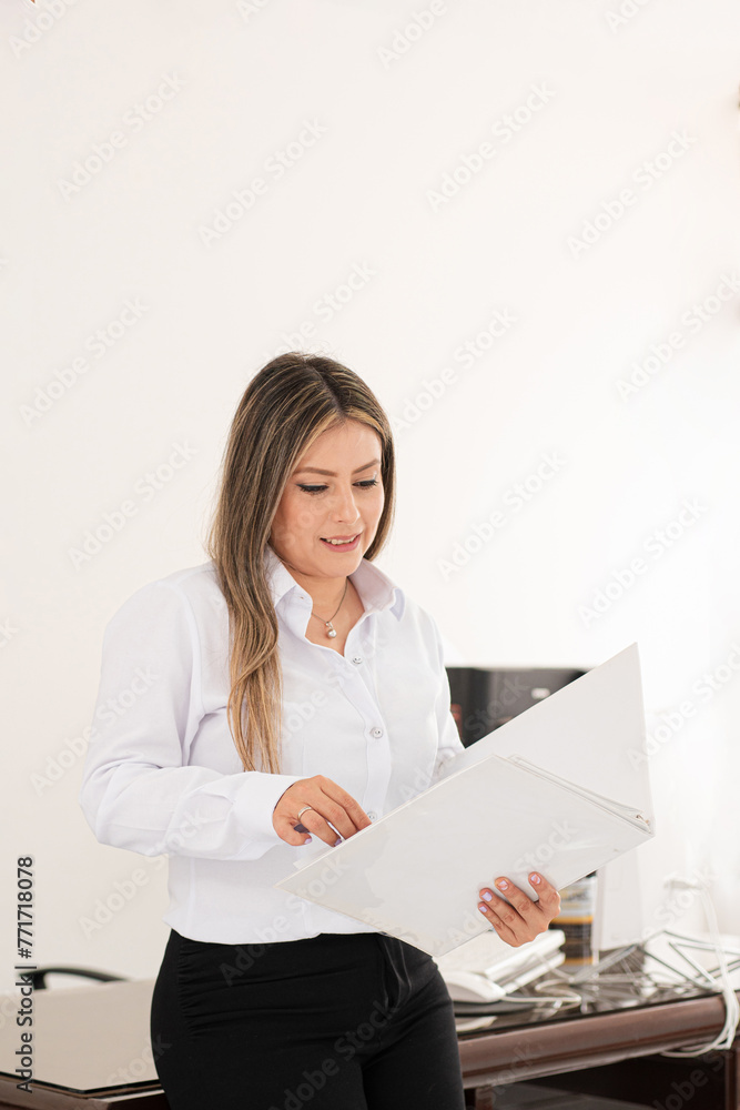 Commercial advisor. Focused Colombian woman at work. She appears focused and professional, carrying out various work-related activities. She is Colombian and has fair skin. Commercial advisor. Focused Colombian woman at work. She appears focused and professional, carrying out various work-related activities. She is Colombian and has fair skin.