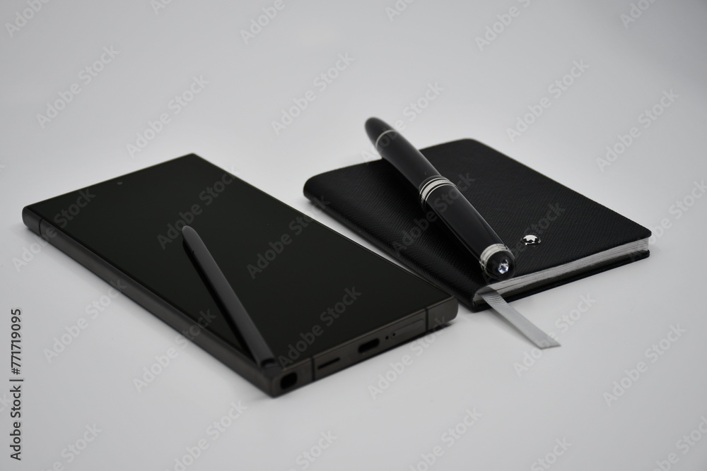 Luxury Smartphone and luxury notebook with pen Luxury Smartphone and luxury notebook with pen
