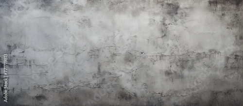 A detailed closeup of a grey concrete wall texture with a freezing monochrome photography aesthetic, resembling natural landscape patterns © AkuAku
