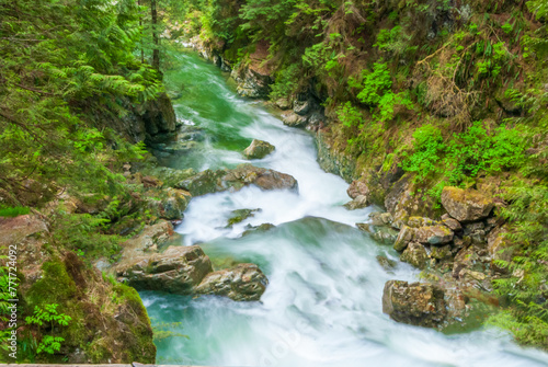 Majestic mountain river long exposure with rocky background in Vancouver, Canada.