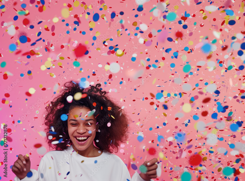 Celebrating Success: Woman with Mobile Phone Surrounded by Gold Confetti Celebrating Success: Woman with Mobile Phone Surrounded by Gold Confetti