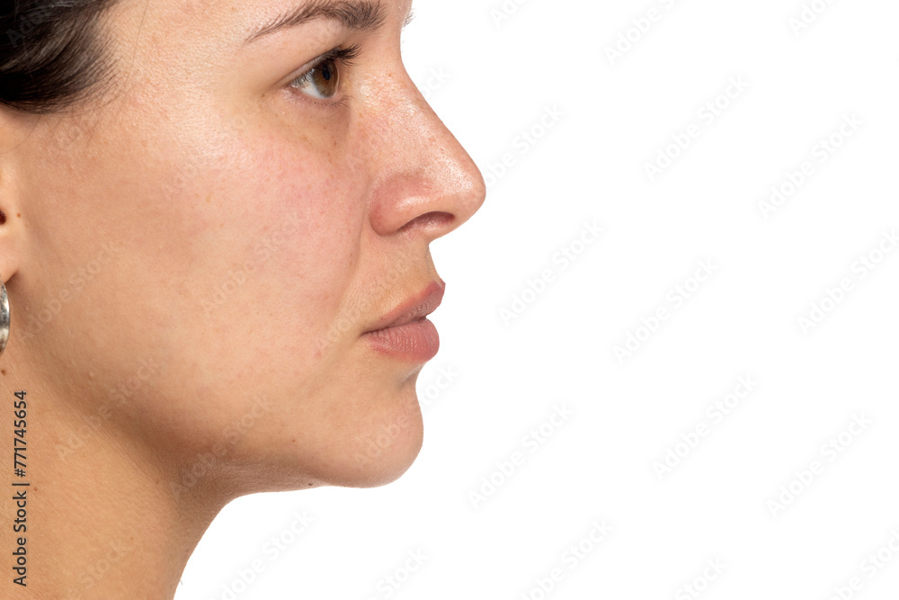 Obraz premium Profile portrait of a natural woman, without makeup, highlighting her unadorned beauty and authenticity on white background