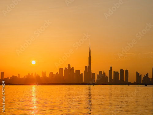 amazing sunset view of Dubai Downtown cityline from Dubai Creek harbour