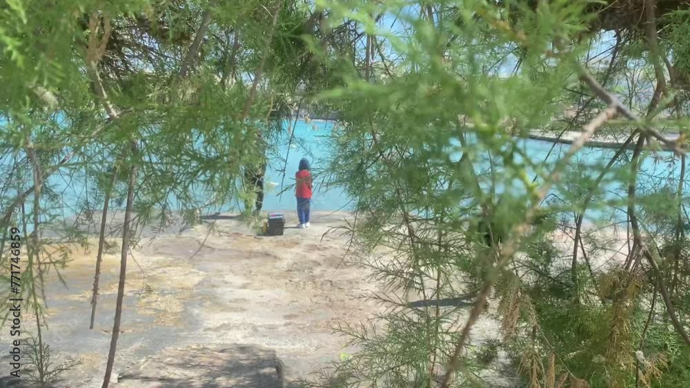 Father and sons fishing on the sea. Young child running towards camera. Malta. High quality 4k footage Father and sons fishing on the sea. Young child running towards camera. Malta. High quality 4k footage