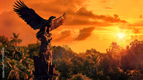 A large eagle is perched on a tree in a jungle photo