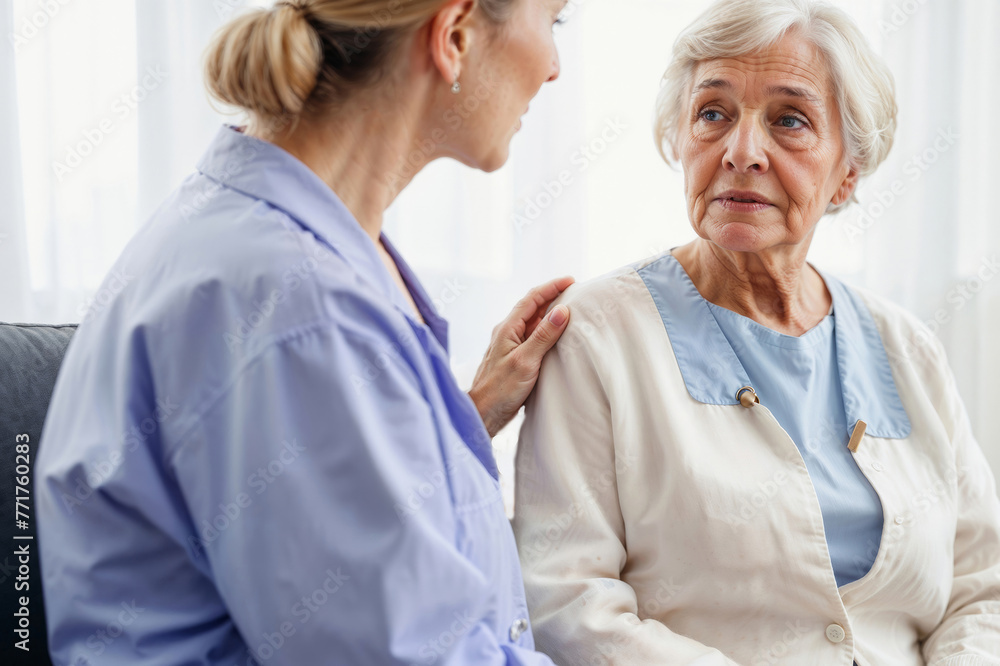 Young home doctor calms an elderly woman. Elderly care and care concept Young home doctor calms an elderly woman. Elderly care and care concept