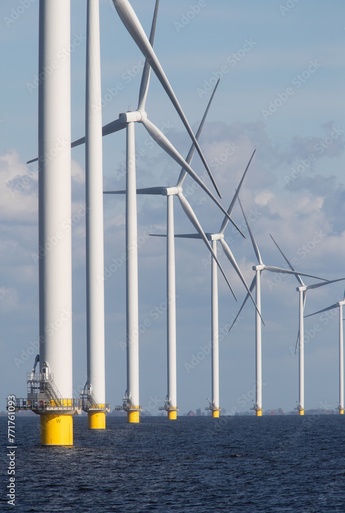Fototapeta premium Windturbines in the water producing alternative green energy