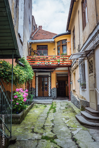 Courtyard of townhouses next to Republic pedestrian street in Old Town of Brasov city, Romania