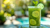 A cucumber drink with mint on a table
