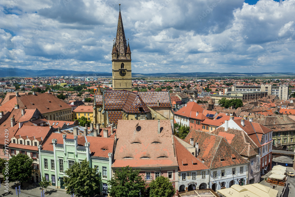 Aerial view from Council Tower with Hermes House and Lutheran Saint Mary Cathedral, Old Town of Sibiu, Romania Aerial view from Council Tower with Hermes House and Lutheran Saint Mary Cathedral, Old Town of Sibiu, Romania