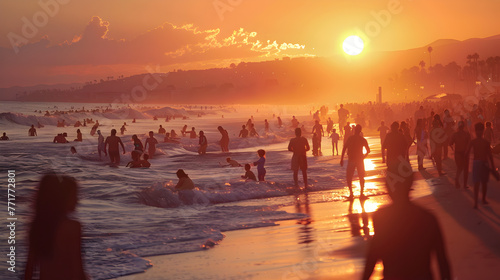 Warm, glowing sunset over a bustling beach filled with people enjoying the summer waves