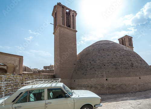 Ancient water reservoir and wind tower called badgir in old part of Kashan city, Iran photo