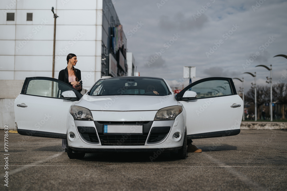 Elegant woman next to an open-roof white car in a city parking space, depicting urban lifestyle Elegant woman next to an open-roof white car in a city parking space, depicting urban lifestyle