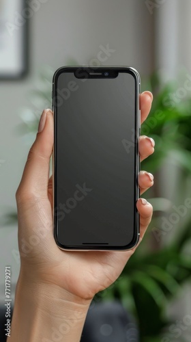 Woman Holding Cell Phone in Hand