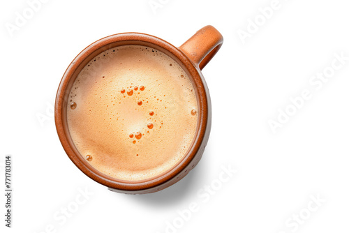 Eartyh Terracotta Ceramic coffe Mug with froth milk, top down view on white background