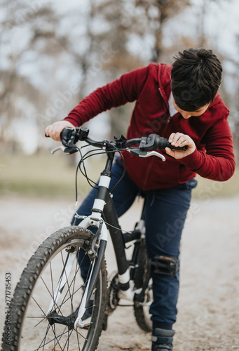 A cheerful young boy rides his bicycle in a city park, immersed in greenery and the freedom of nature.