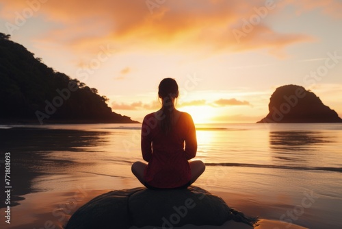 One Woman in Lotus Position Doing Meditation and Mindfulness Practice on Beach During Sunset