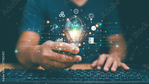 Artificial Intelligence of futuristic innovative technology for business concept, Businessman holding lightbulb with Ai and icon of financial technology and business administration, Chat with AI.