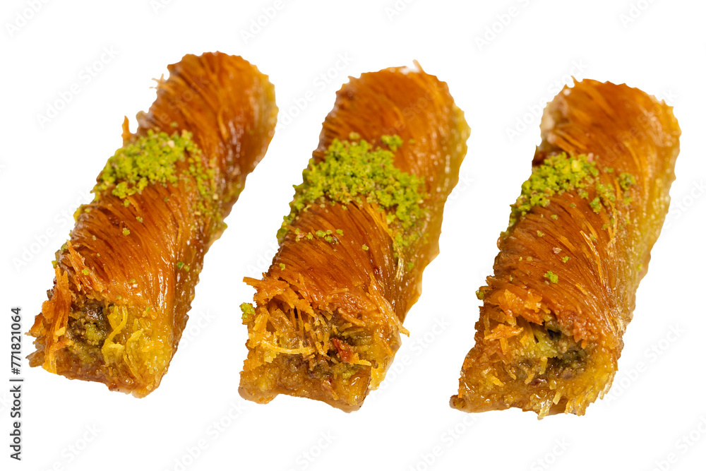 Kadayıf with pistachios isolated on white background. Turkish cuisine delicacies. Ramadan Dessert. local name burma kadayif Kadayıf with pistachios isolated on white background. Turkish cuisine delicacies. Ramadan Dessert. local name burma kadayif