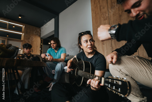 фотографія Casual gathering of friends at home, one playing guitar, creating a relaxed and comfortable atmosphere