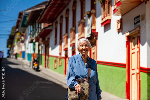 Senior woman tourist at the beautiful heritage town of Salamina in the department of Caldas in Colombia © anamejia18