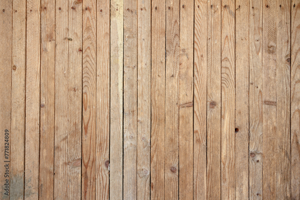 A wooden wall with a grainy texture A wooden wall with a grainy texture