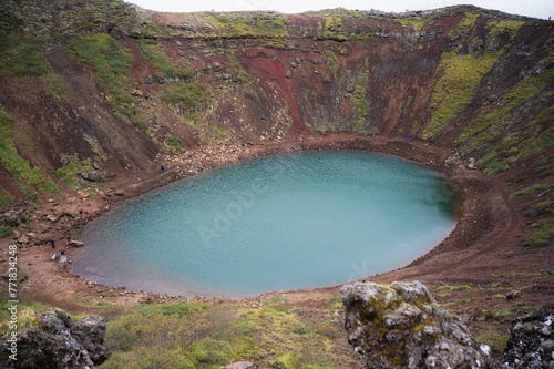 f Kerid crater with blue lake water. Travel destination concept