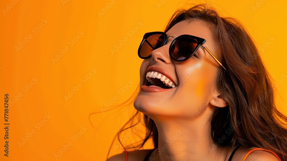 A joyful young woman wearing sunglasses, laughing and enjoying the sunshine, against a vivid orange background, real photo, stock photography generative ai A joyful young woman wearing sunglasses, laughing and enjoying the sunshine, against a vivid orange background, real photo, stock photography generative ai