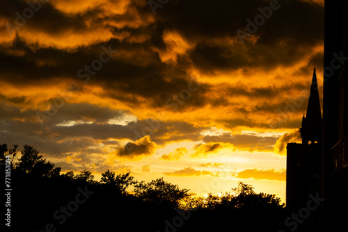 Church silhouette on the bright sunset sky background. Tall cathedral in Montreal.  © Kateryna