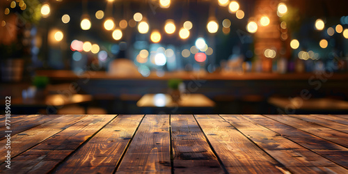 Empty wood table for product display in blur background of admirable restaurant at night. on the table at mall blurred background.