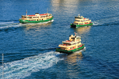 Ferries on Sydney Harbour.  Commercial tour boats travelling between north shore Sydney and terminals at Circular Quay. 