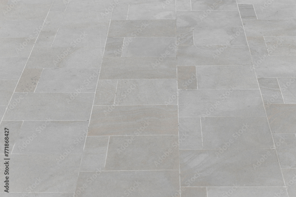 Fototapeta premium Grey mosaic stone ceramic floor tile background surface texture backdrop road urban
